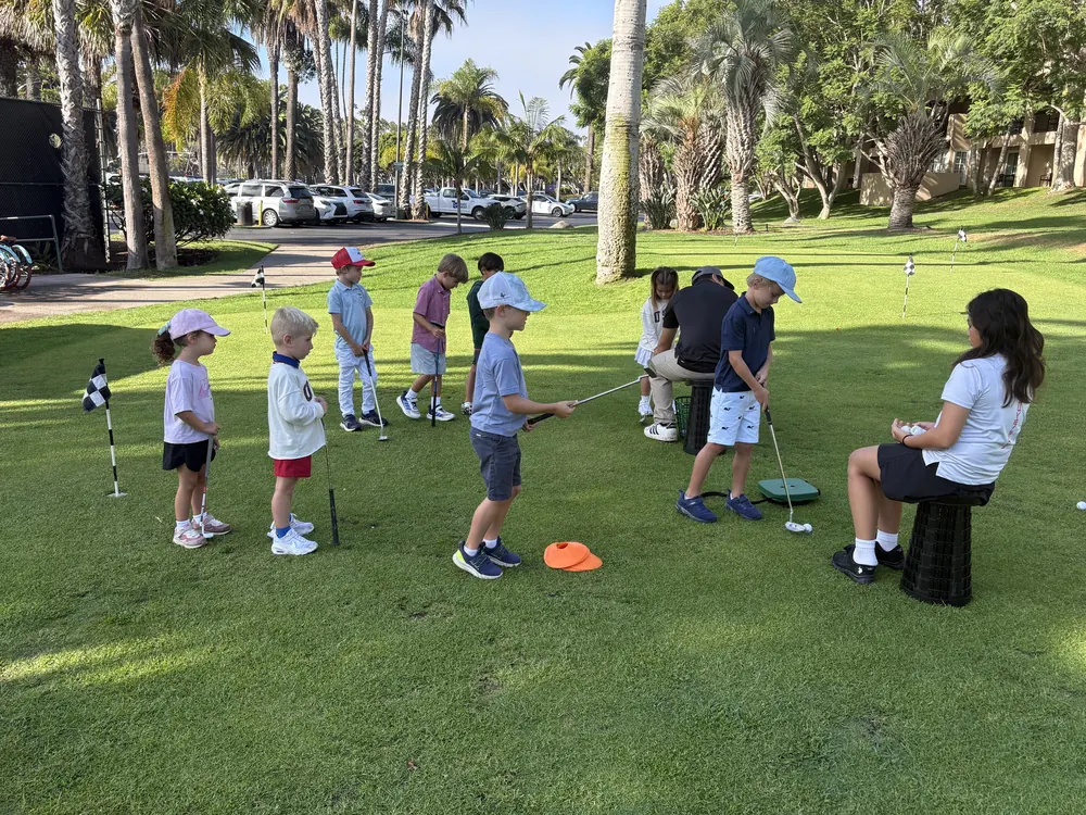 Players taking turns putting toward the flag